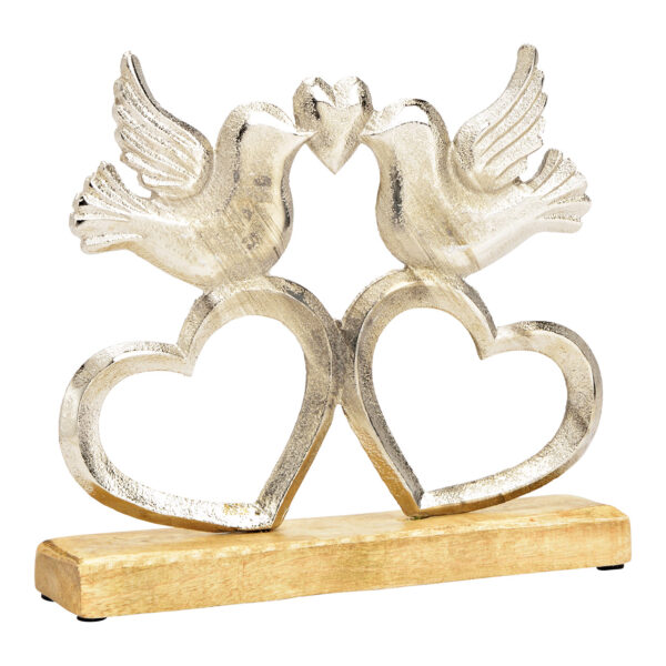 Pájaro de pie sobre corazón, sobre base de madera de mango, fabricado en metal plateado (An./Al./Pr.) 25x22x5cm