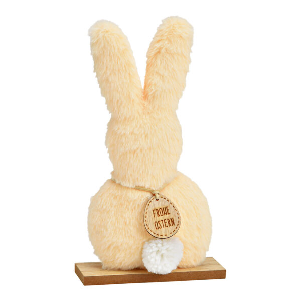 Conejo de pie de peluche sobre base de madera color melocotón (An./Al./Pr.) 14x25x5cm