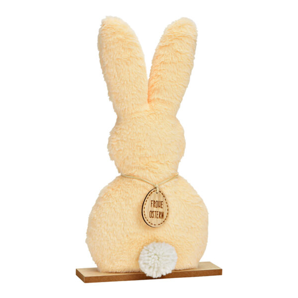 Conejo de pie de peluche sobre base de madera color melocotón (An./Al./Pr.) 20x36x5cm